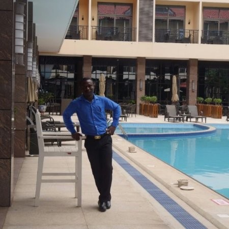 JOHN MAAMU